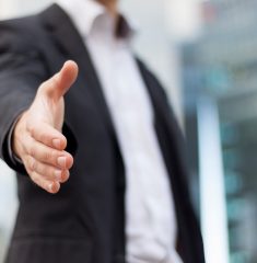 Businessman with an open hand ready to seal a deal